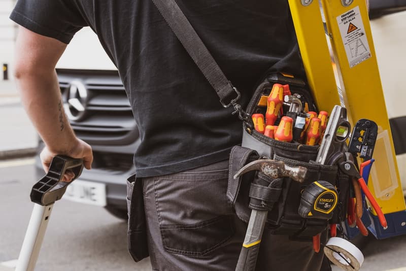 A local handyman with a loaded tool pouch and truck, ready to head out across LA