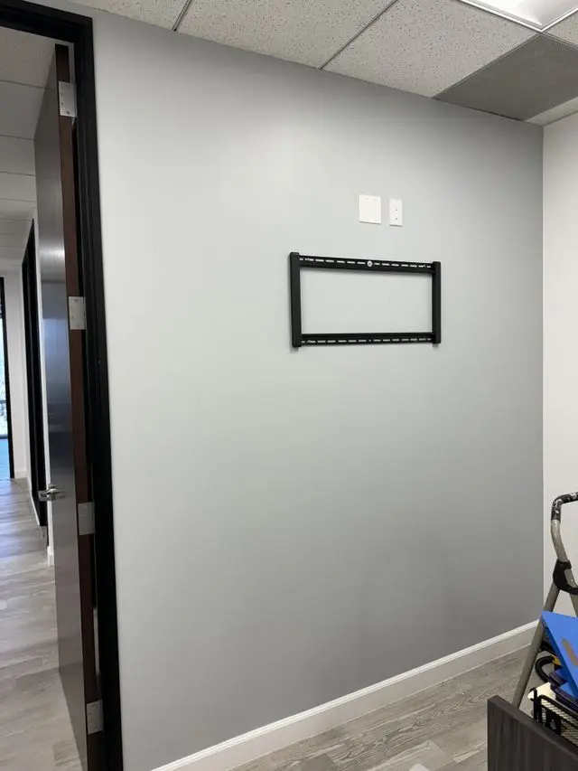 Bare wall bracket mounted and levelled, waiting for the screen. Work by Construction Hub in Los Angeles.