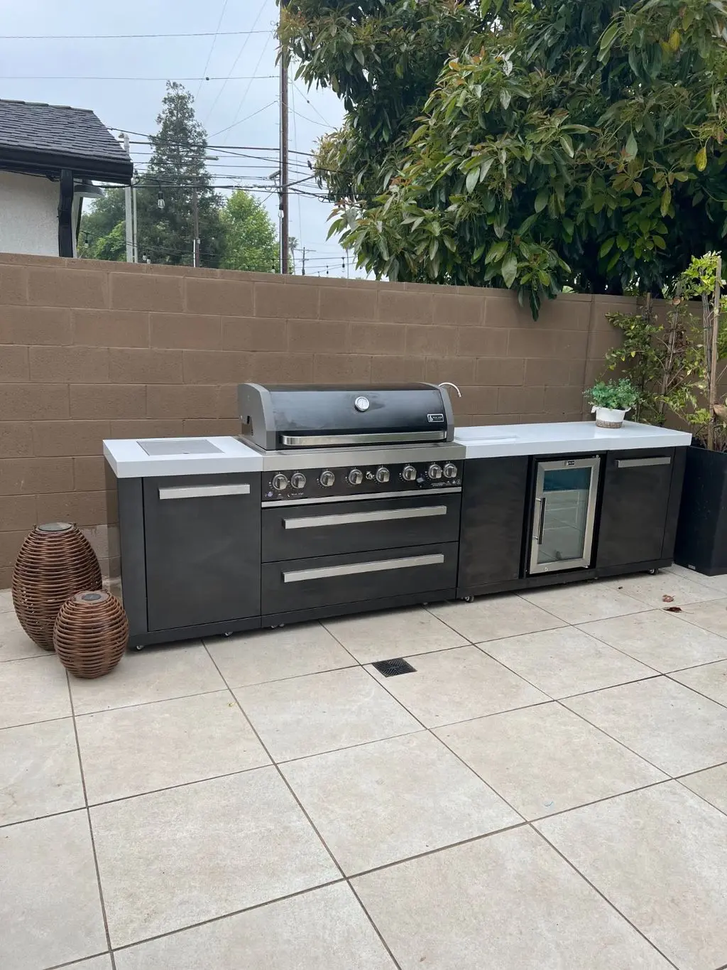 Assembled modular outdoor grill island on tiled patio. Work by Construction Hub in Los Angeles.
