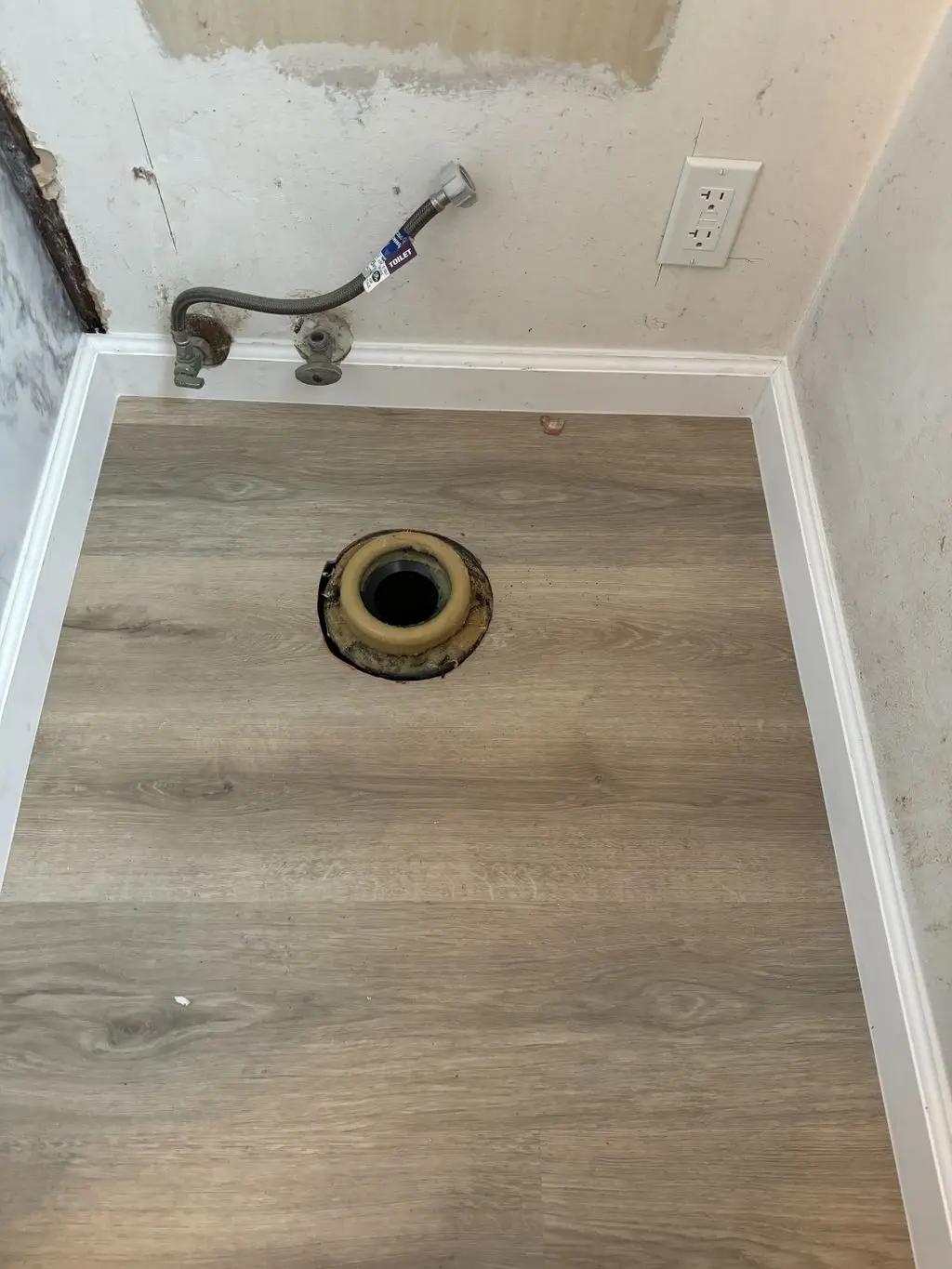 Open toilet flange with wax ring before toilet is set. Work by Construction Hub in Los Angeles.